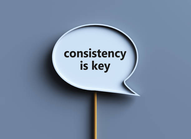 Motivational message on consistency Speech bubble with text consistency is key on a gray background