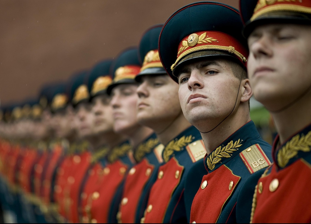 Military honor guard in formal uniforms Line of soldiers in ceremonial uniforms standing at attention during a formal event