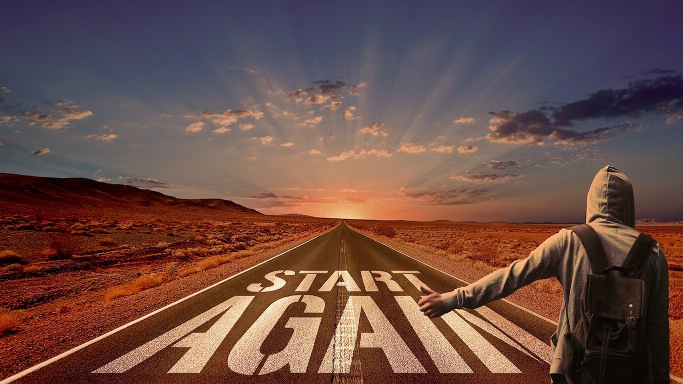 Motivational road with inspiring sunset message Person hitchhiking on a desert road at sunset with message 'Don't Lose Hearts' on the pavement